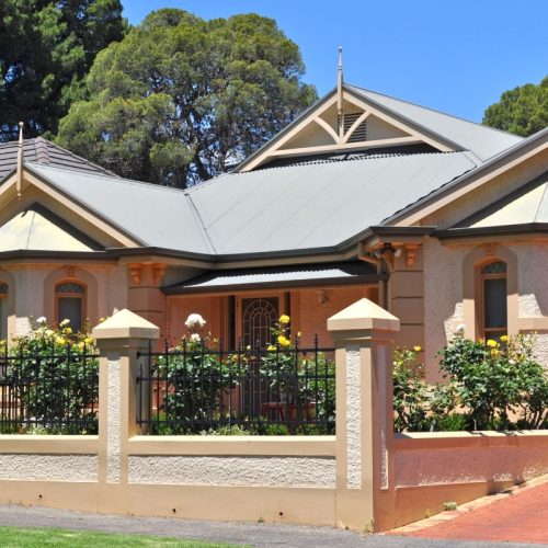 Exterior Australian traditional style home, with heritage screen doors that add charm and character.